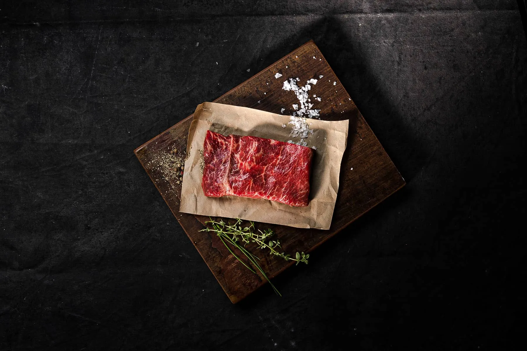 Skewered picanha cooking over open flame